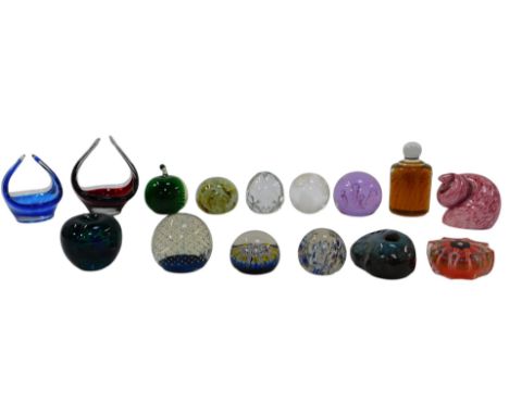 A group of glass paperweights, to include a millefiore paperweight with star and twisted cane decoration, 6.5cm diameter, a p