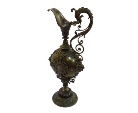 A cast metal table lamp modelled as a Continental ewer, decorated with busts, scrolls, etc., 48cm high.
