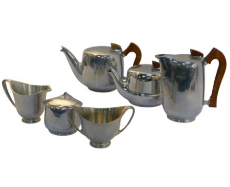 A Picquot ware part service, comprising teapot, bachelors teapot, hot water jug, lidded sugar bowl, and two jugs. 