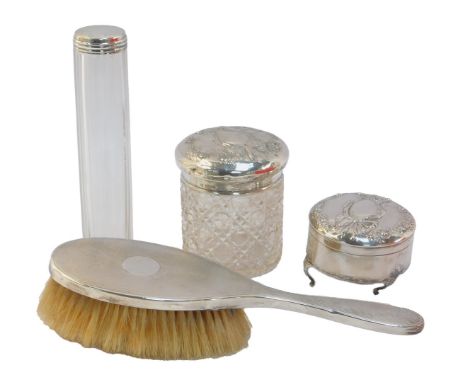Silver mounted dressing table wares, comprising an Edward VII silver mounted hairbrush with engine turned decoration, London 