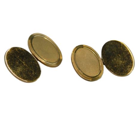 A pair of 9ct gold cufflinks, of oval form with engine turned decoration, 11.4g. 