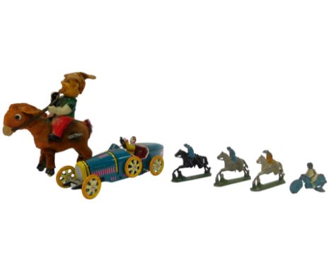A group of toys, comprising a tinplate wind up automobile, lacking key, 18cm long, together with a wind up figure on a donkey
