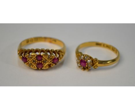Two ruby and diamond rings, both 18ct, including one circular cluster (size K), and one boat shaped having four rubies with s