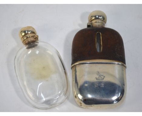 An Edwardian hip flask with silver hinged bun cover and detachable beaker, leather sleeve, William Hutton & Sons Ltd., London