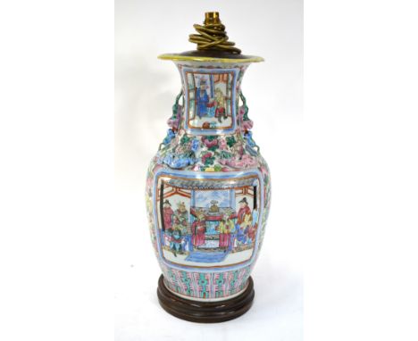 A Canton famille rose vase, decorated with two panels of figures in narrative scenes; about 47cm high; Qing Dynasty or later 