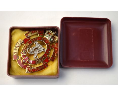 A 9ct yellow gold and diamond set badge brooch, Queen Victoria's Own Corps of Guides, highlighted with small diamonds and red