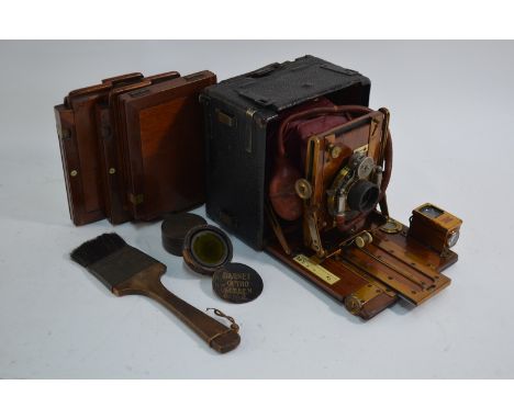 A morocco-bound mahogany quarter-plate camera with red leather bellows, lacquered brass mounts and Bausch & Lomb 1891 patent 