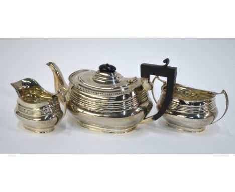 A silver three-piece tea service in the Regency manner, oblong form with banded reeding and gadrooned rims, S. Blackensee & S