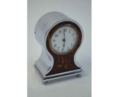 A chrome and simulated tortoiseshell miniature balloon-cased alarm clock, on bun feet, 9.5 cm