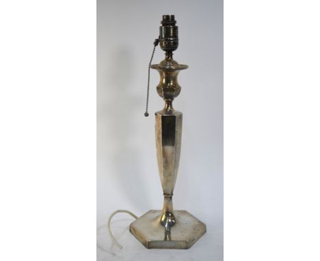 A large loaded silver table lamp in the form of a hexagonal baluster candlestick, Hawksworth, Eyre & Co. Ltd., Sheffield 1927