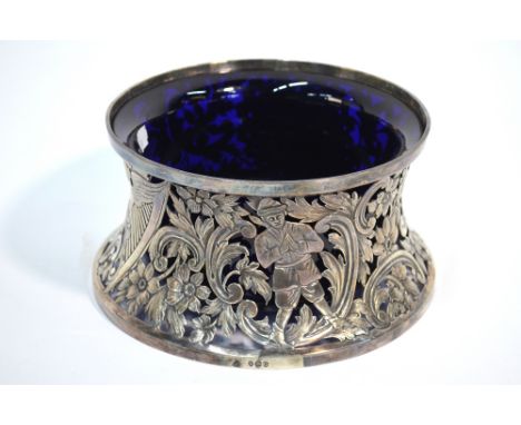A late Victorian silver 'Irish' potato ring of waisted form, ornately embossed and chased with birds, figures and harp, Carri