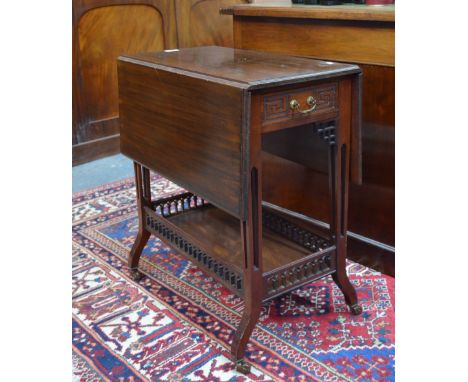 A late 19th/20th century walnut Sutherland table in the Chinese Chippendale style, the drop leaf top over a frieze drawer opp