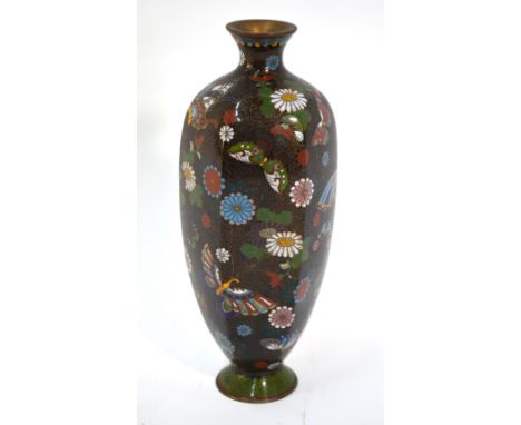 A Japanese cloisonne enamel vase of tapering, hexagonal form, decorated with invertebrates and flowerheads on a black ground,