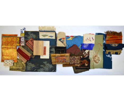 A quantity of Japanese and other textiles, including: a Chinese or Korean rank badge decorated with a Buddhistic Lion, 30 x 2
