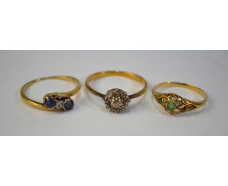 A diamond set cluster ring, the centre stone approx 0.10 cts, yellow and white metal set, size R 1/2, to/w emerald and rose d