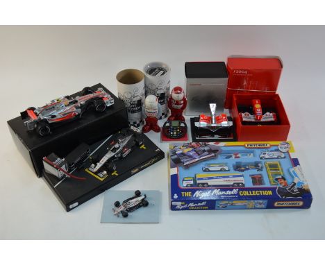 Two scale model Formula 1 McLaren racing cars, to/with two replica scale model nose cone assemblies, a boxed Matchbox Nigel M
