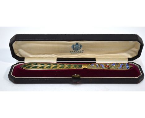 An Imperial Russian gilt metal and plique-a-jour enamel letter knife, decorated with floral and foliate designs, in fitted ca