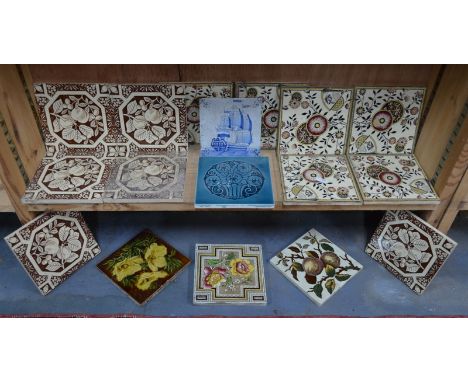 A small collection of tiles, mostly floral designs; together with one tile decorated with a three-masted sailing vessel