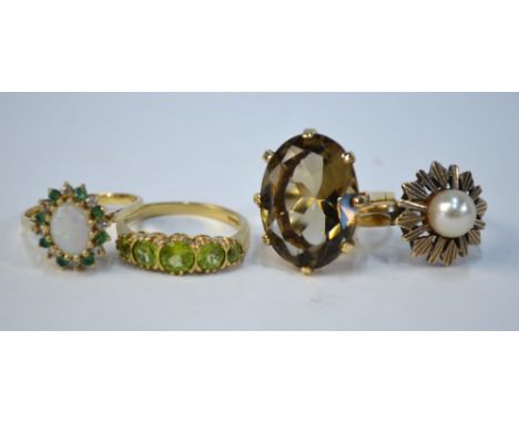 Four 9ct rings including oval claw set smoky quartz, size O, a single cultured pearl, size N 1/2, five stone peridot size O, 