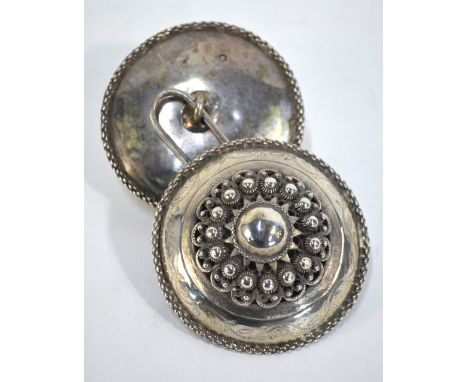 A Dutch 833 grade cloak-clasp, as two outsize button-bosses with star centres, beading, piercing and chain rims, linked by an