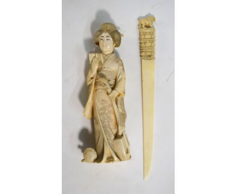 An ivory okimono of a Yamato Nadeshko, holding a samisen with her left hand, 18cm high, Meiji/Taisho Period; together with an