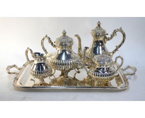 A Peruvian sterling four-piece tea/coffee service of half-reeded pear shape, to/w a two-handled rectangular tray, Camusso, Li