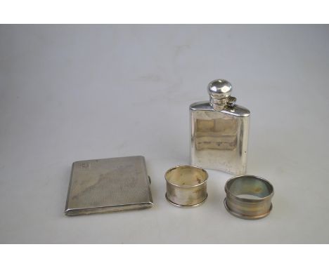 A small silver hip-flask with hinged bayonet bun cover, London 1928, to/w a heavy quality cigarette case, London 1950 and two