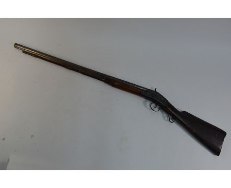 A 19th century percussion lock sporting gun with 76 cm Damascus barrel, wooden ramrod,  walnut (possibly) half-stock with eng