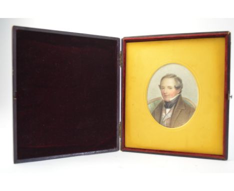 A Victorian watercolour portrait miniature on paper of a gentleman in chequered waistcoat, unsigned, in gilt slip and large v