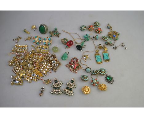 An interesting collection of Eastern and Oriental jewellery items including pendant earrings, clip-on earrings, pendants, bea