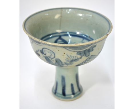 Two pieces of blue and white ceramics, comprising: a stem cup with circular bowl, 11cm high and a joss-stick or other holder 