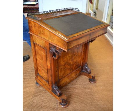 A Victorian burr walnut Davenport, the 3/4 gilt metal galleried top over a hinged slope enclosing six bright satinwood drawer