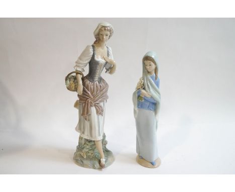 A Lladro figure of a Country lady with a basket of flowers, 29.5cm high, and a further Lladro figure of a girl wearing a shaw