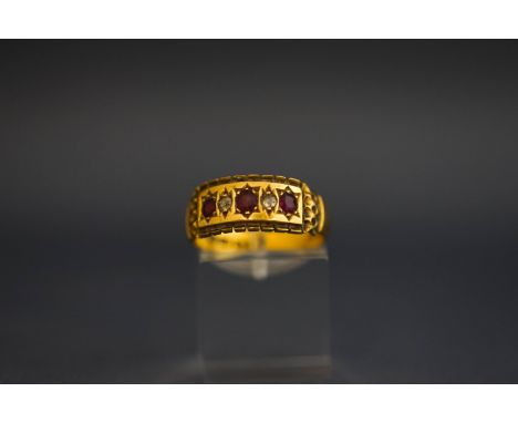 An Edwardian 18 carat gold diamond and ruby set ring, Chester 1905, finger size O, 3.9 g gross