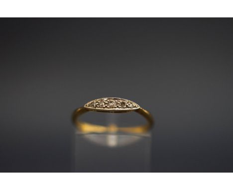 A five stone diamond ring, stamped '18ct', set with graduated single cuts, finger size O, 2 g gross