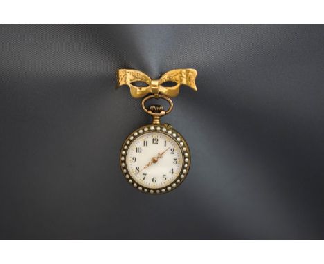 An enamel fob watch, the white enamel dial enclosed by seed pearls, the reverse with blue guilloche enamel decoration, suspen