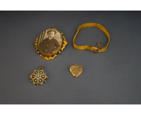A Victorian gold, turquoise and seed pearl star brooch, a 9 carat gold heart locket, a 19th century photograph in gilt metal 