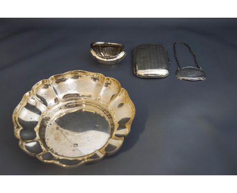 A silver dish, of round lobed form; a silver cigarette case; a silver Sherry decanter label; and a silver salt; 245 g (7.9 tr