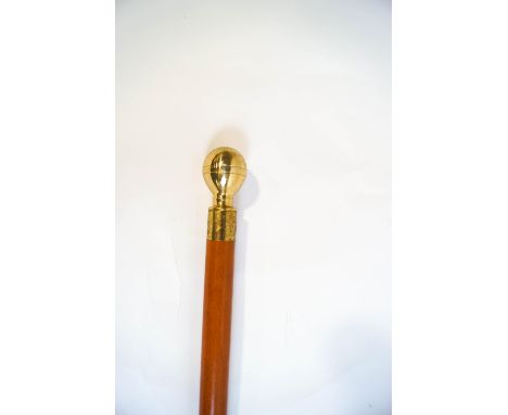 A walking cane, the brass knop unscrews to reveal a compass