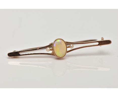 A YELLOW METAL OPAL AND SEED PEARL BAR BROOCH, designed with a central, oval cut opal cabochon within a collet mount, flanked