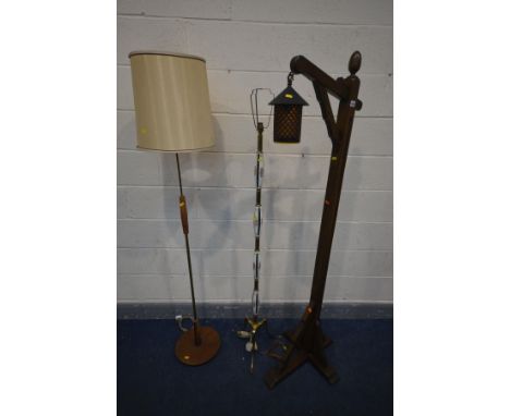 AN OAK LANTERN STANDARD LAMP, with cylindrical orange shade, along with a mid-century teak and brass standard lamp, and a bra