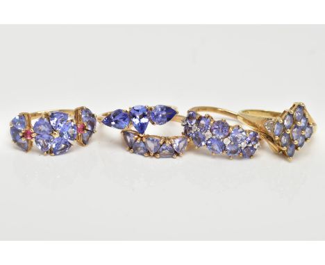 FIVE 9CT GOLD TANZANITE RINGS, to include a three stone tanzanite ring, pear shaped, one stone positioned upright while the t