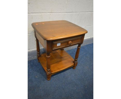 AN ERCOL GOLDEN DAWN LAMP TABLE with a single drawer