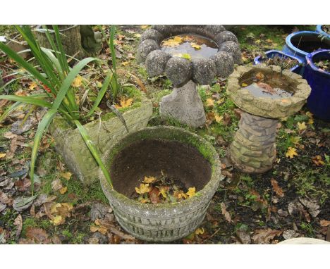 FOUR COMPOSITE GARDEN FEATURES comprising a square tapered planter, width 40cm x height 35cm a circular barrel effect planter