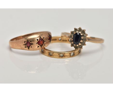 THREE 9CT GOLD GEM SET RINGS, the first an eternity ring set with circular colourless gems assessed as spinel's, the second a