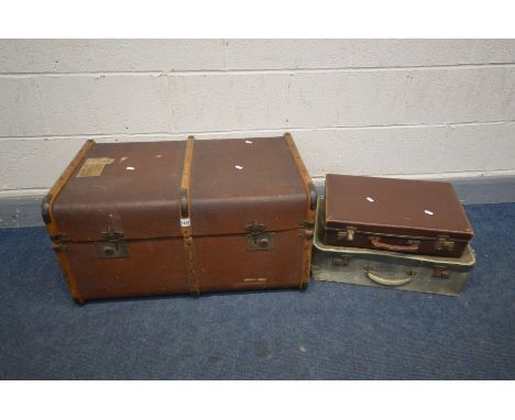 A VINTAGE CANVAS AND WOODEN BOUND TRAVELING TRUNK (missing internal tray and right handle) along with two other suitcases (3)
