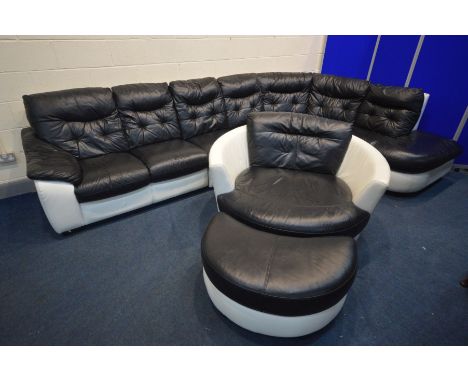 A BLACK AND WHITE LEATHER LOUNGE SUITE, comprising a rounded corner sofa, comes in four sections, max length 368cm x min leng