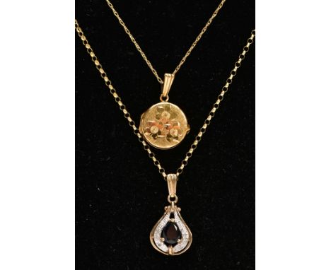 TWO 9CT GOLD PENDANT NECKLACES, the first a floral detailed circular locket, hallmarked 9ct gold London, fitted with a tapere
