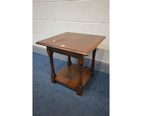 A REPRODUCION OAK LAMP TABLE, on turned and block legs united by an undershelf, 50cm squared x height 50cm