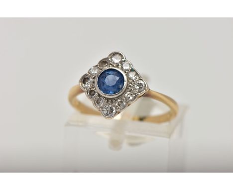 A YELLOW METAL SAPPHIRE AND DIAMOND CLUSTER RING, the cluster of a square shape, designed with a central circular cut blue sa